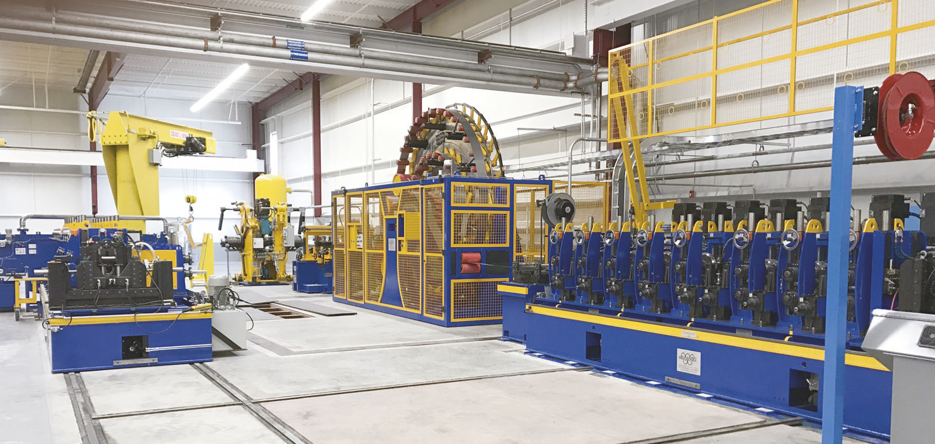 Mill for production of high frequency welded stainless steel tubes, with quick roll change system by cassettes on railways.